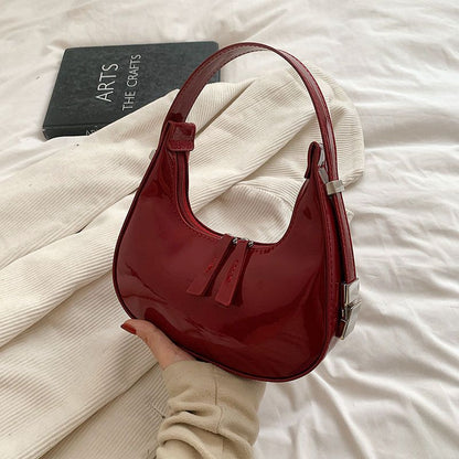 Sacs à bandoulière en cuir verni Scilla